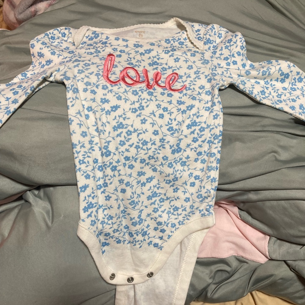 Beautiful ever and ever blue onesie with a pink heart across the chest.